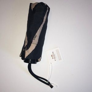 Coach umbrella brand new with cover